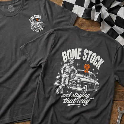 T-shirt with skeleton leaning on classic car, "Bone Stock" text, and a race flag.