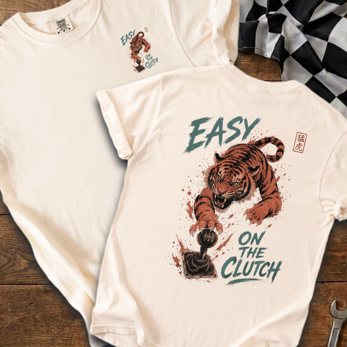 Cream t-shirt with tiger on gear shift and "Easy On The Clutch" text.