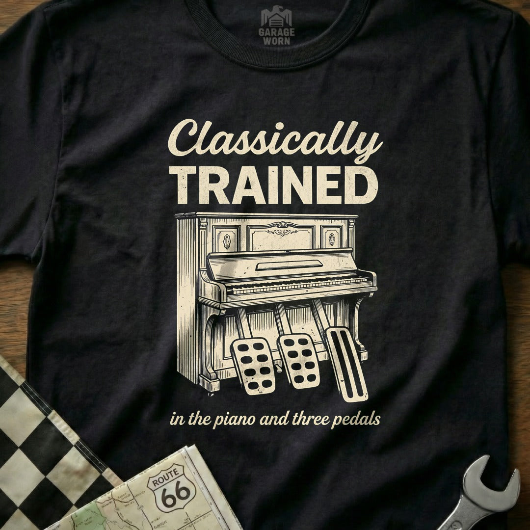 Black t-shirt with "Classically Trained" and piano pedals design.