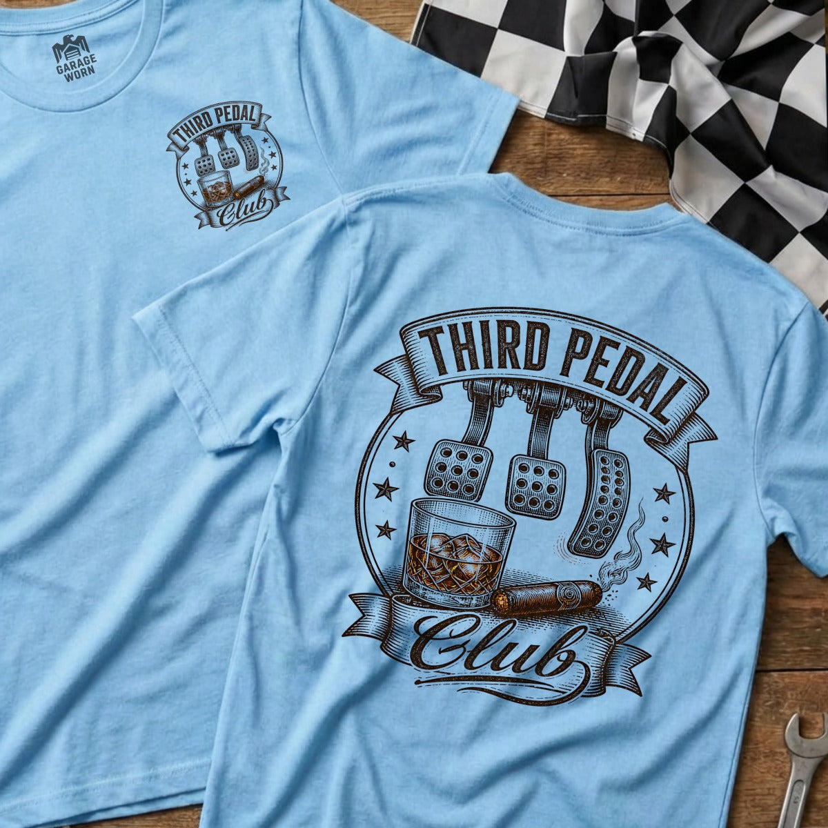 Light blue t-shirt with "Third Pedal Club" graphic featuring pedals, cigar, and whiskey.
