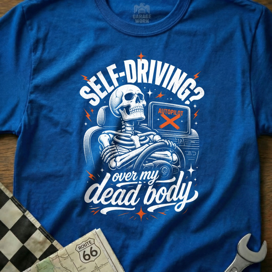 Blue t-shirt with skeleton driving, "Self-driving? Over my dead body" text.