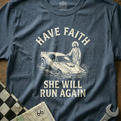 Jesus with hand on classic car submerged in water, text says "Have Faith She Will Run Again".