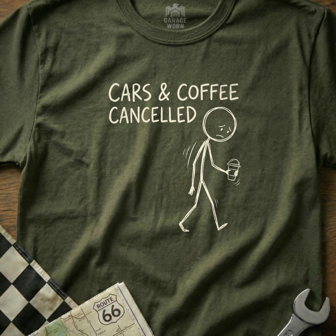 Olive green t-shirt with graphic of stick figure holding coffee cup, text "CARS & COFFEE CANCELLED".