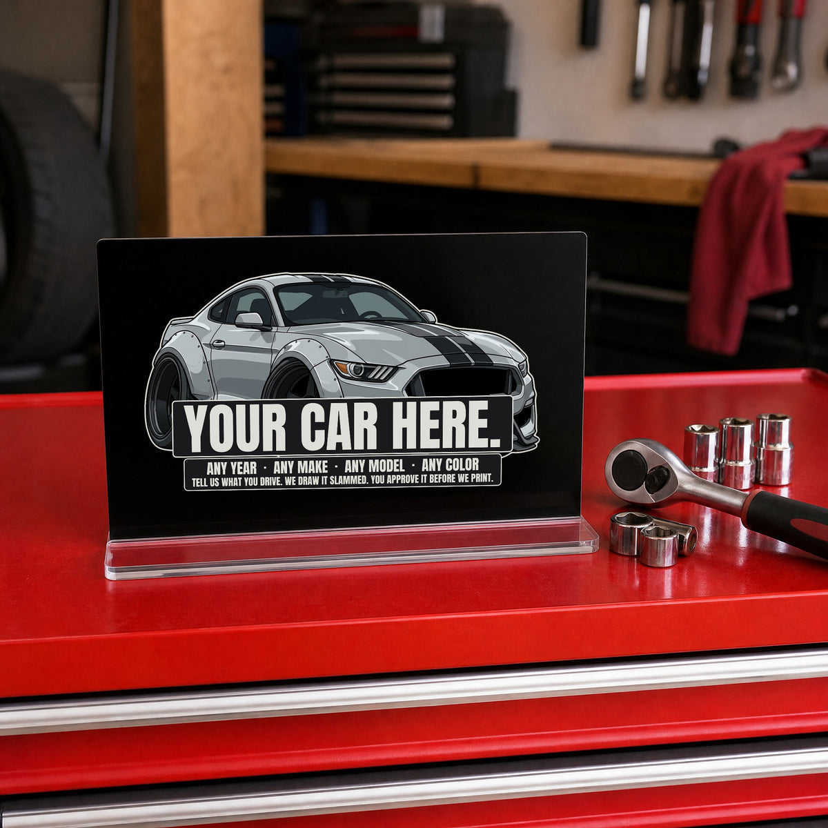 Your car here - black glossy acrylic desk sign on a tool chest