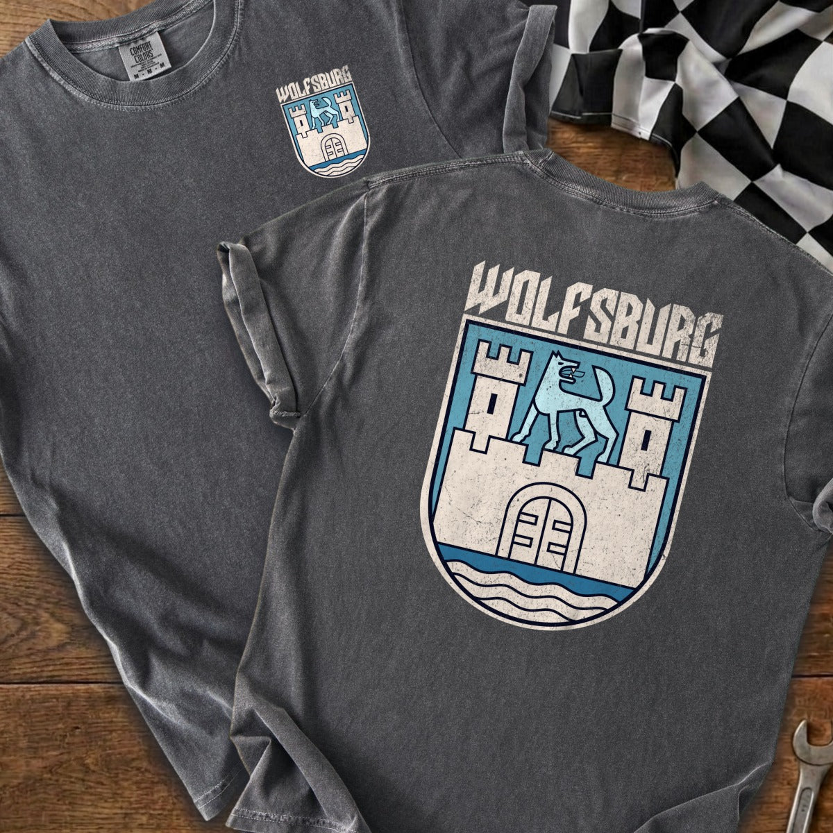 Dark grey t-shirts with "Wolfsburg" and a castle-like crest graphic.