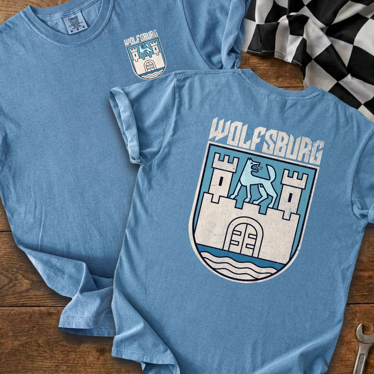 Light blue t-shirts featuring "Wolfsburg" text and a crest.