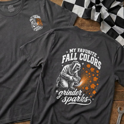 Dark t-shirt with graphic of a welder, sparks, autumn leaves, and text.