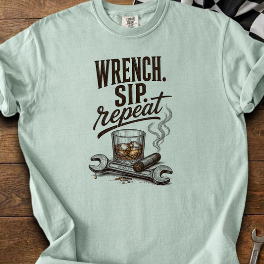 Light blue t-shirt with "Wrench. Sip. Repeat." text and illustration.