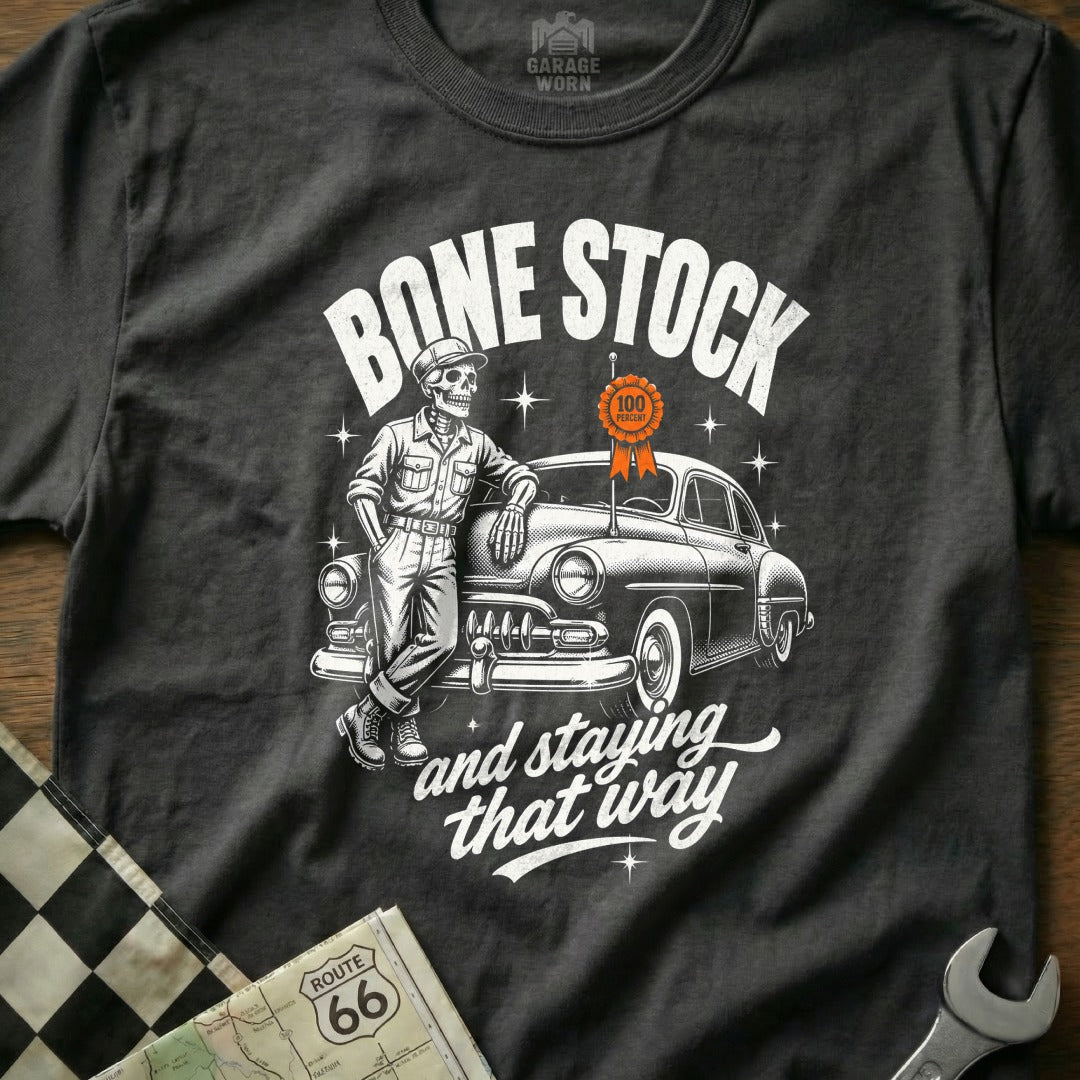 T-shirt graphic with skeleton leaning on vintage car, reads "Bone Stock".