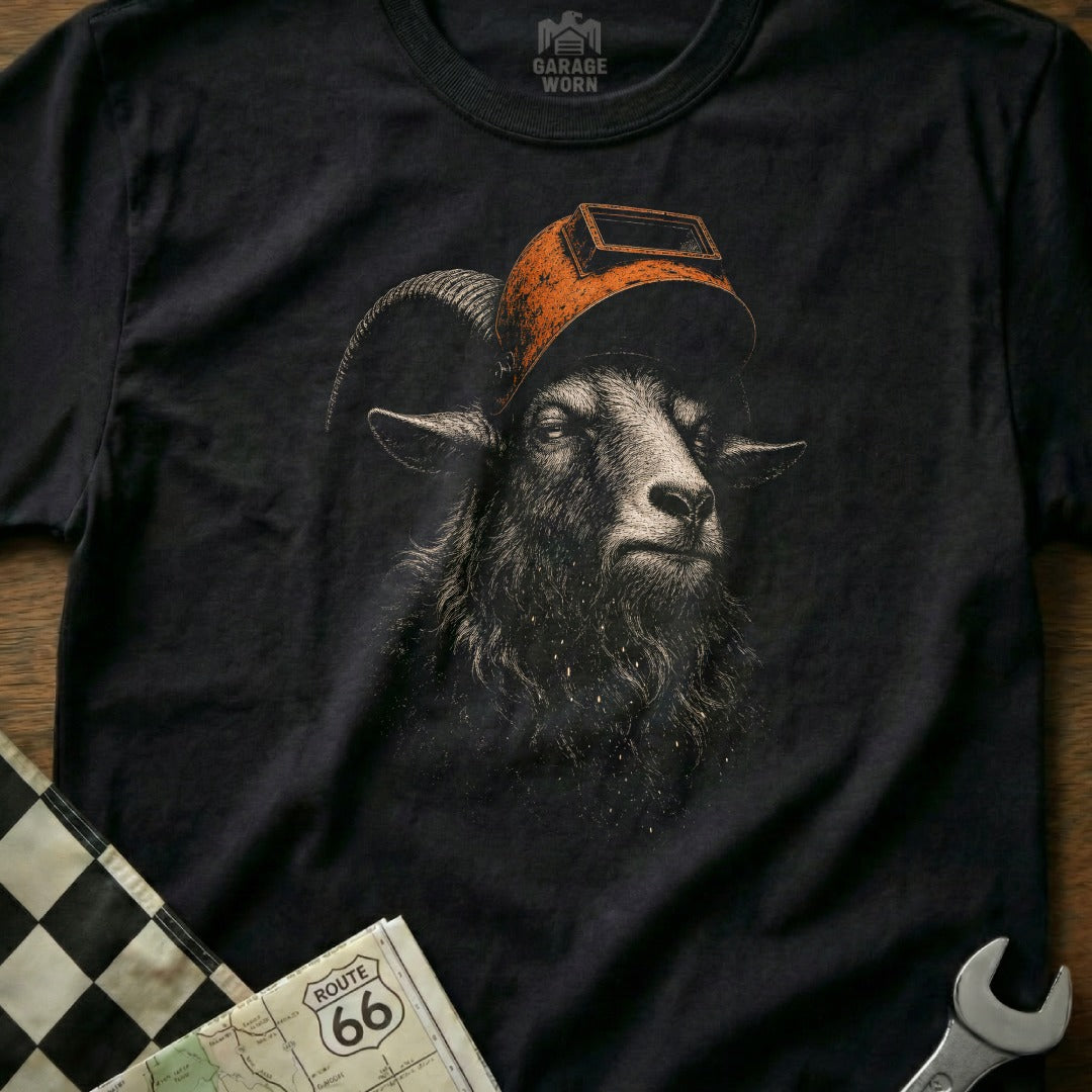 Black t-shirt with welding mask-wearing goat graphic, Route 66 map, and checkered flag detail.