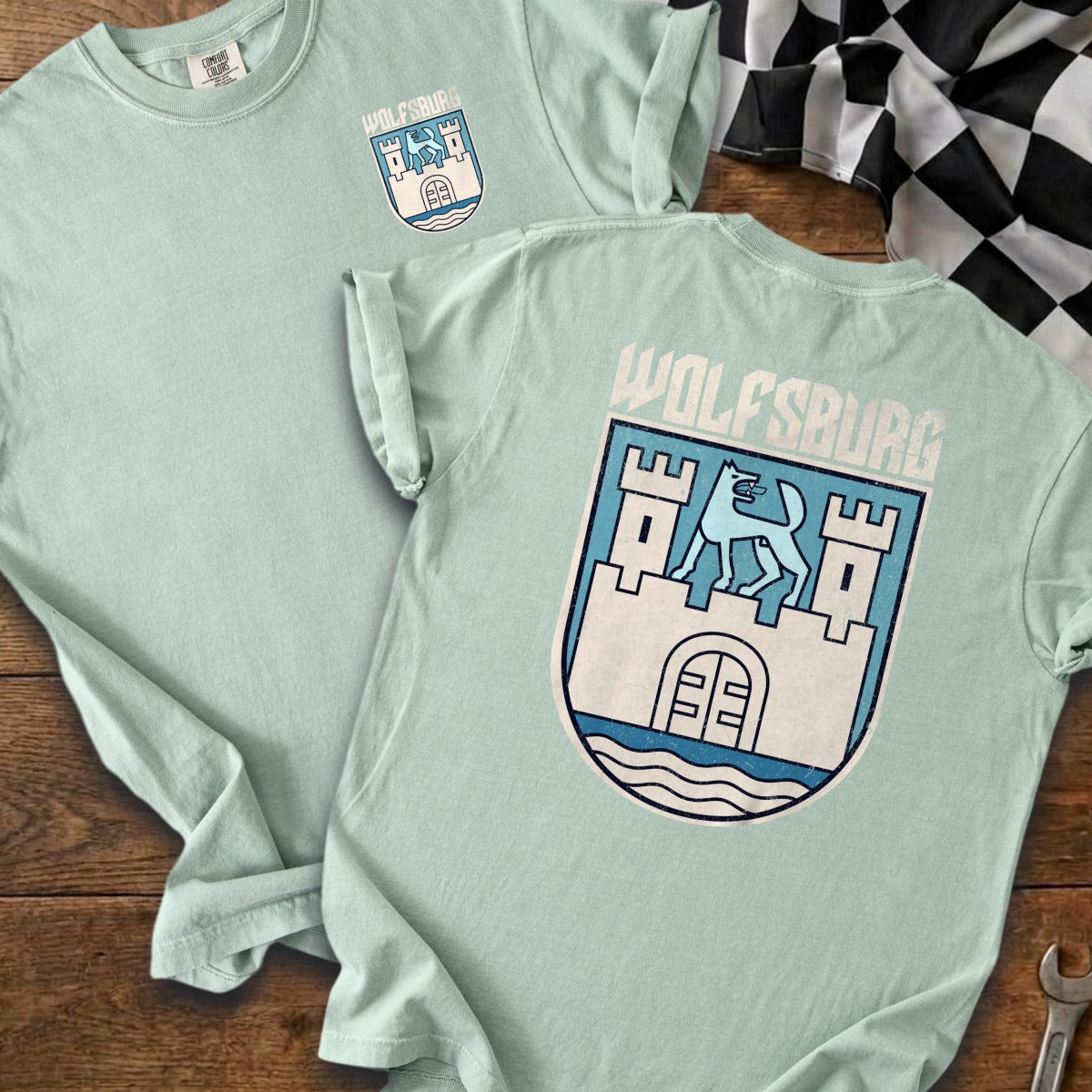 Mint green t-shirts with Wolfsburg crest graphic and checkered flag.