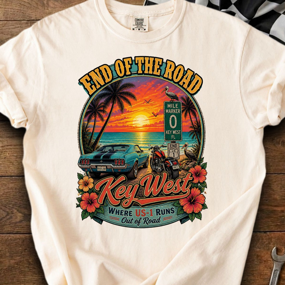 Key West t-shirt graphic with vintage car, motorcycle, and sunset over the ocean.