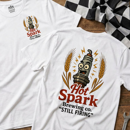White t-shirt with Hot Spark Brewing Co. "Still Firing" logo featuring a cartoon spark plug.