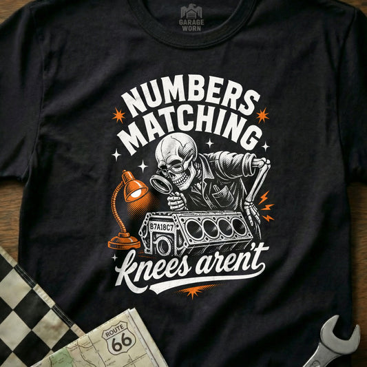Skeleton with magnifying glass examining engine block, "NUMBERS MATCHING knees aren't".