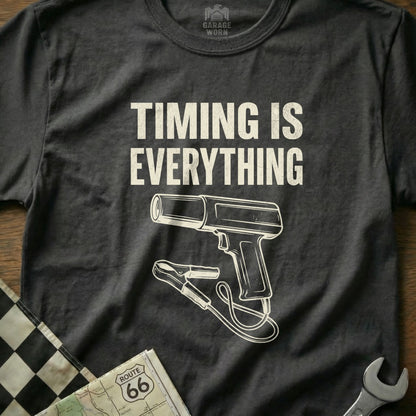 Dark t-shirt with white text "TIMING IS EVERYTHING" and a graphic of a timing light.
