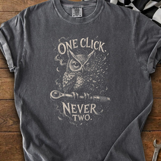 Graphic t-shirt with owl, wrench, and text "ONE CLICK NEVER TWO."