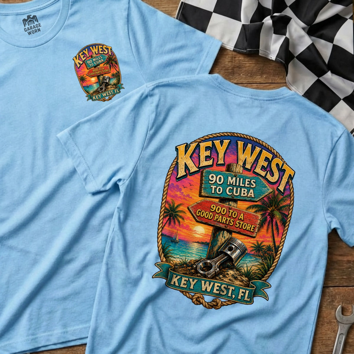 T-shirt with Key West beach scene and signs to Cuba and a good parts store.