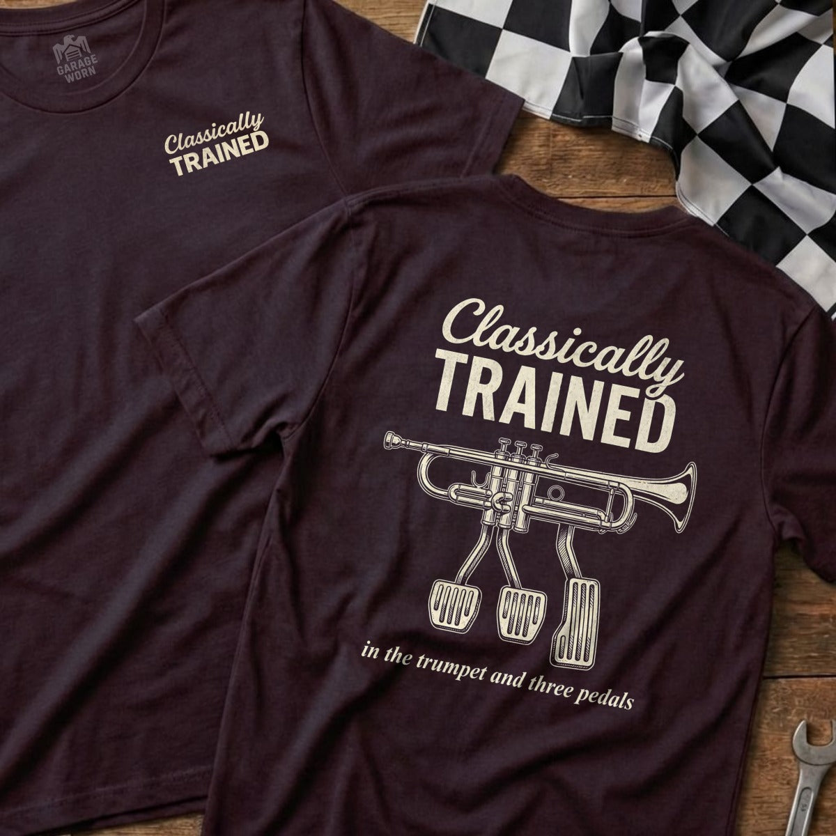 Burgundy t-shirt with "Classically Trained" text and trumpet with three pedals illustration.