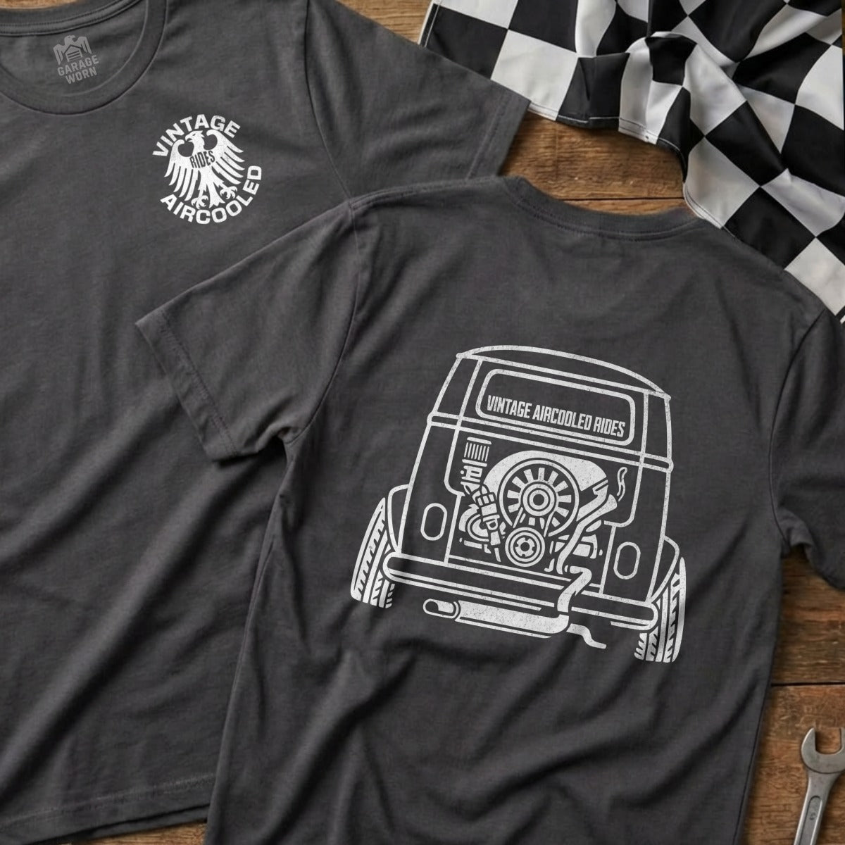 Dark gray t-shirt with a graphic of a vintage van's rear engine on back.