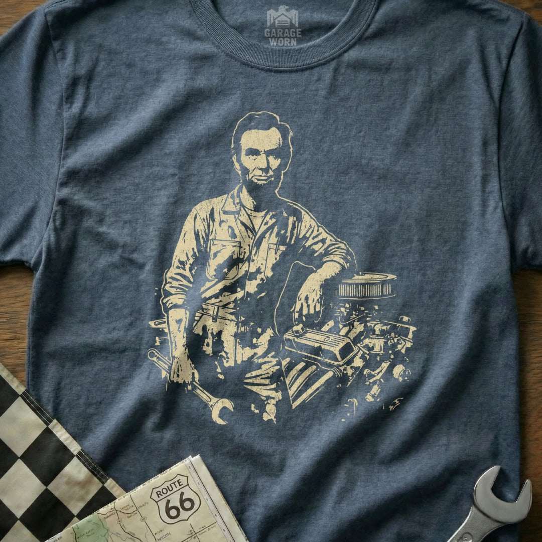 Abraham Lincoln in mechanic's overalls leans on an engine, holding a wrench.