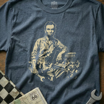 Abraham Lincoln in mechanic's overalls leans on an engine, holding a wrench.