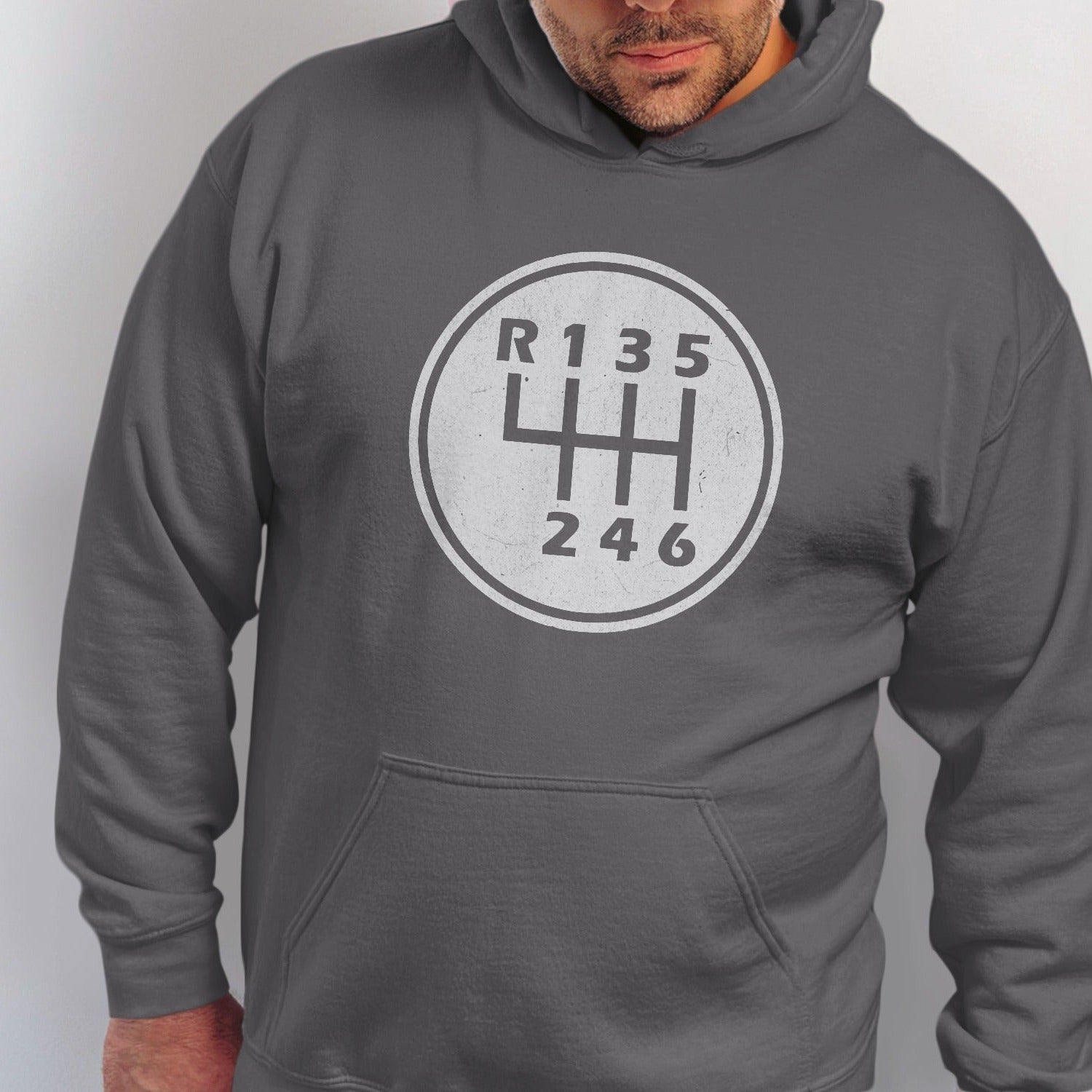 Grey hoodie with a white distressed six-speed manual transmission shift pattern graphic.