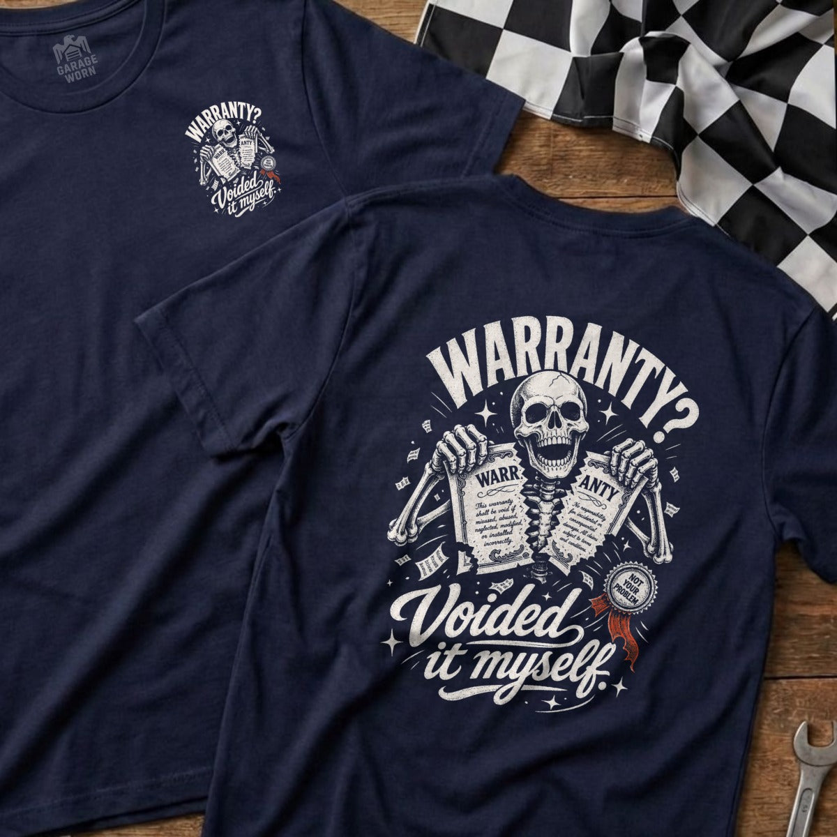 Navy t-shirt with skeleton holding "Voided it myself" warranty documents graphic.