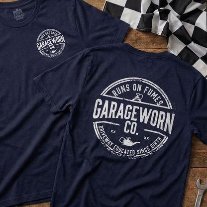 Navy t-shirts with "Garage Worn Co. Runs on Fumes Driveway Educated Since Birth" text.