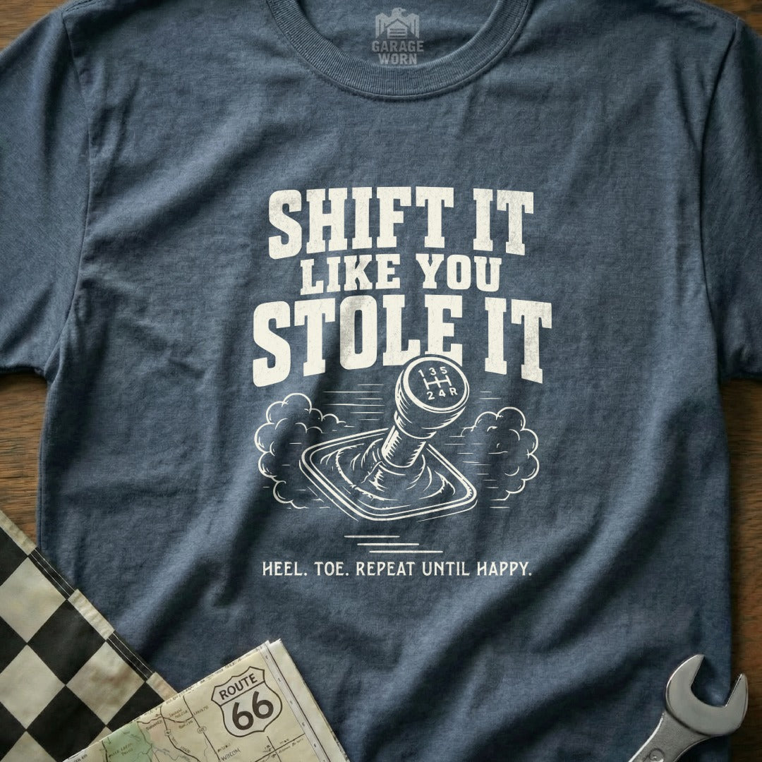Heathered t-shirt with text "Shift it like you stole it" and gear shifter illustration.