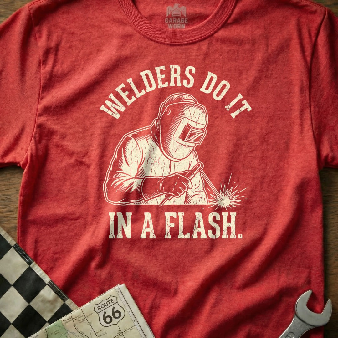 Red t-shirt graphic with a welder and "Welders Do It In A Flash."