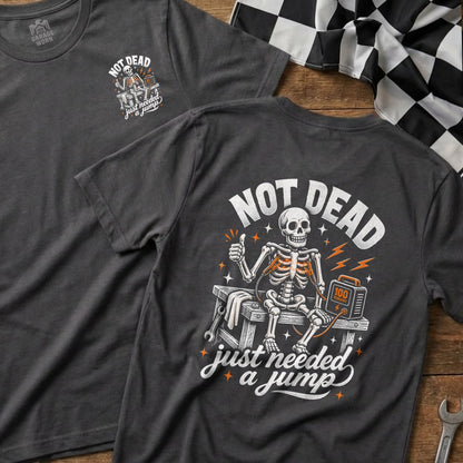 Skeleton with jumper cables and "Not Dead, Just Needed a Jump" text.