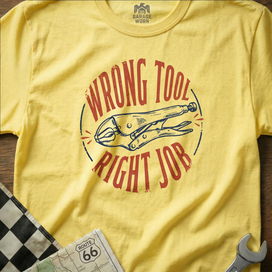 Yellow t-shirt with red and blue "Wrong Tool, Right Job" text and pliers graphic.