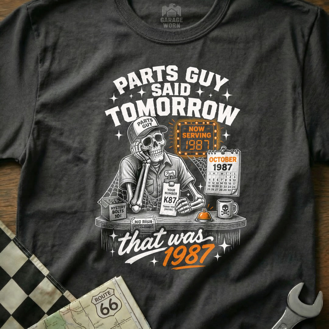 Skeleton "Parts Guy" with "1987" and October calendar on shirt.