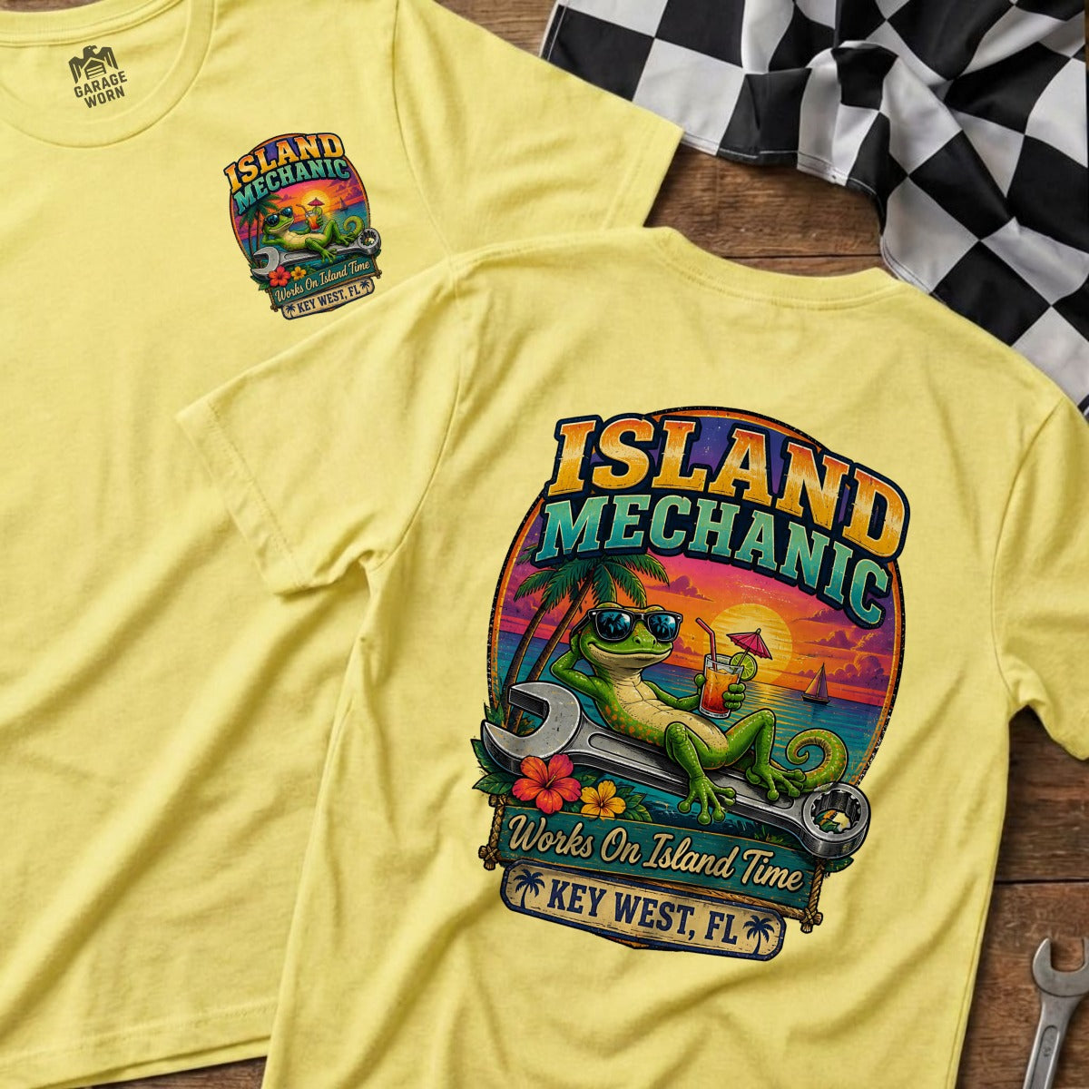 Yellow t-shirt with "Island Mechanic" graphic featuring a gecko relaxing on a wrench.