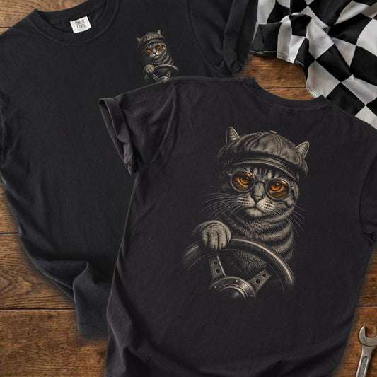 Black t-shirt with a detailed graphic of a cat wearing a cap and glasses, holding a steering wheel.
