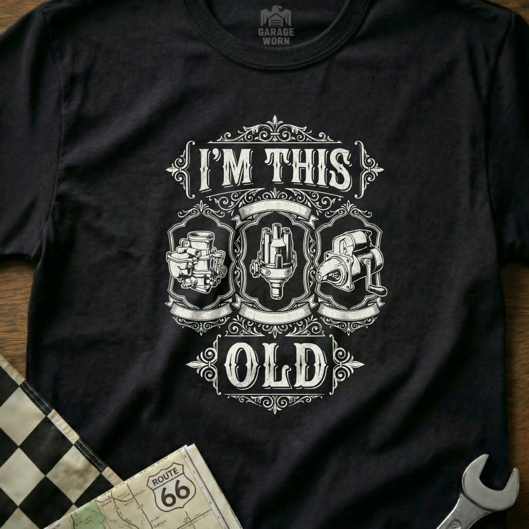 Black t-shirt with "I'm This Old" and vintage car parts graphic.