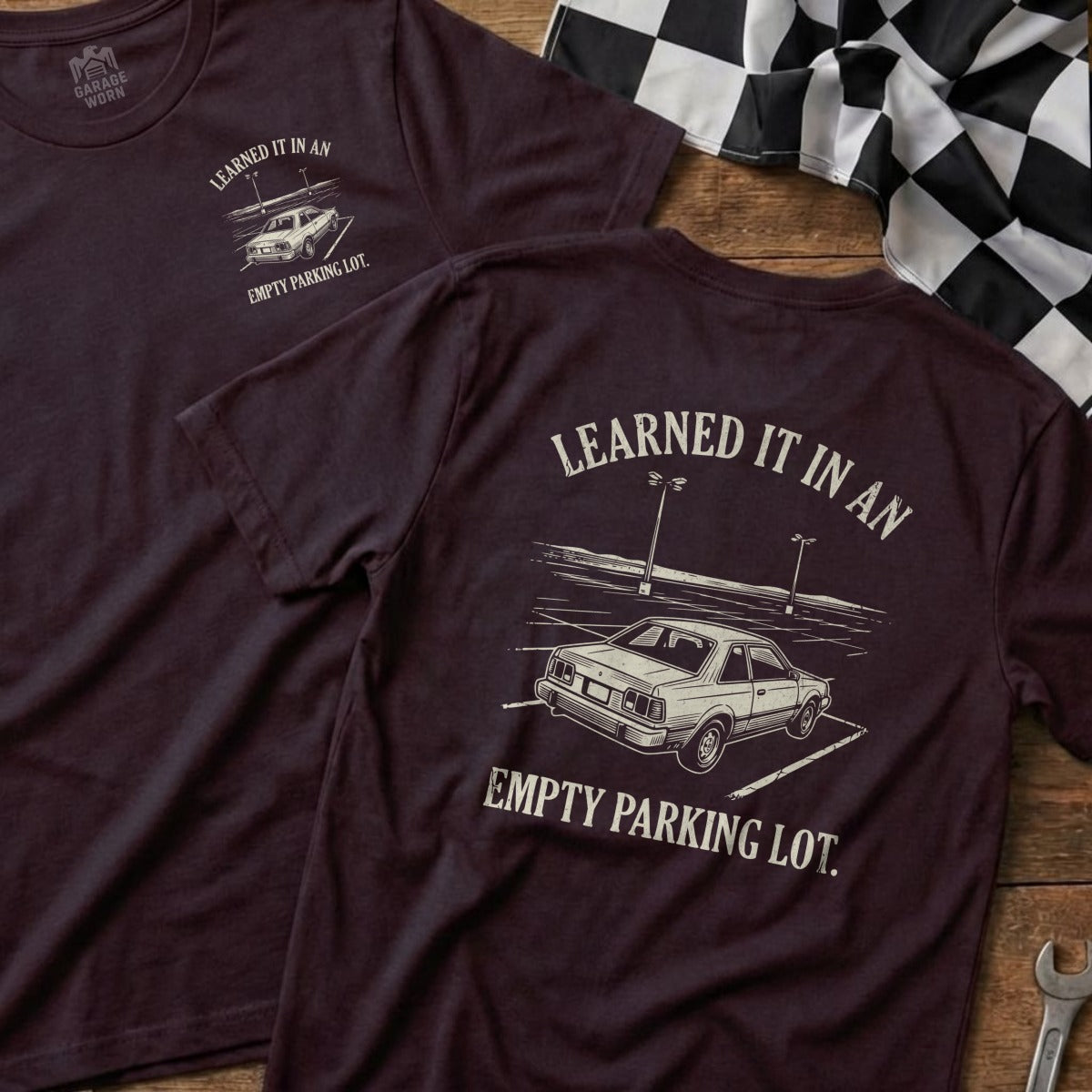 Dark t-shirts with "Learned it in an empty parking lot" and car graphic.