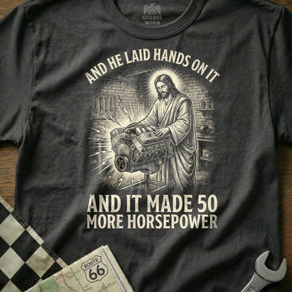Jesus working on an engine, text reads "And he laid hands on it and it made 50 more horsepower".