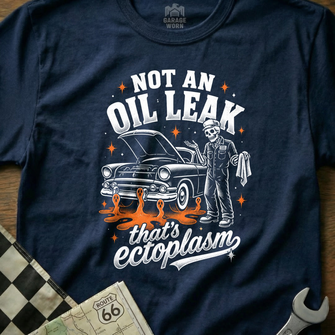 Skeleton mechanic next to vintage car with "Not an oil leak that's ectoplasm" text.