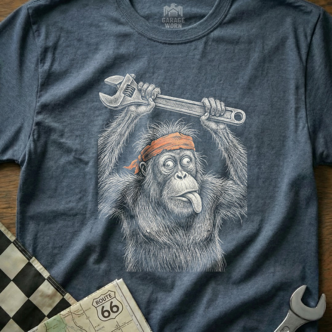 Illustration of a chimpanzee holding a wrench above its head with tongue out.