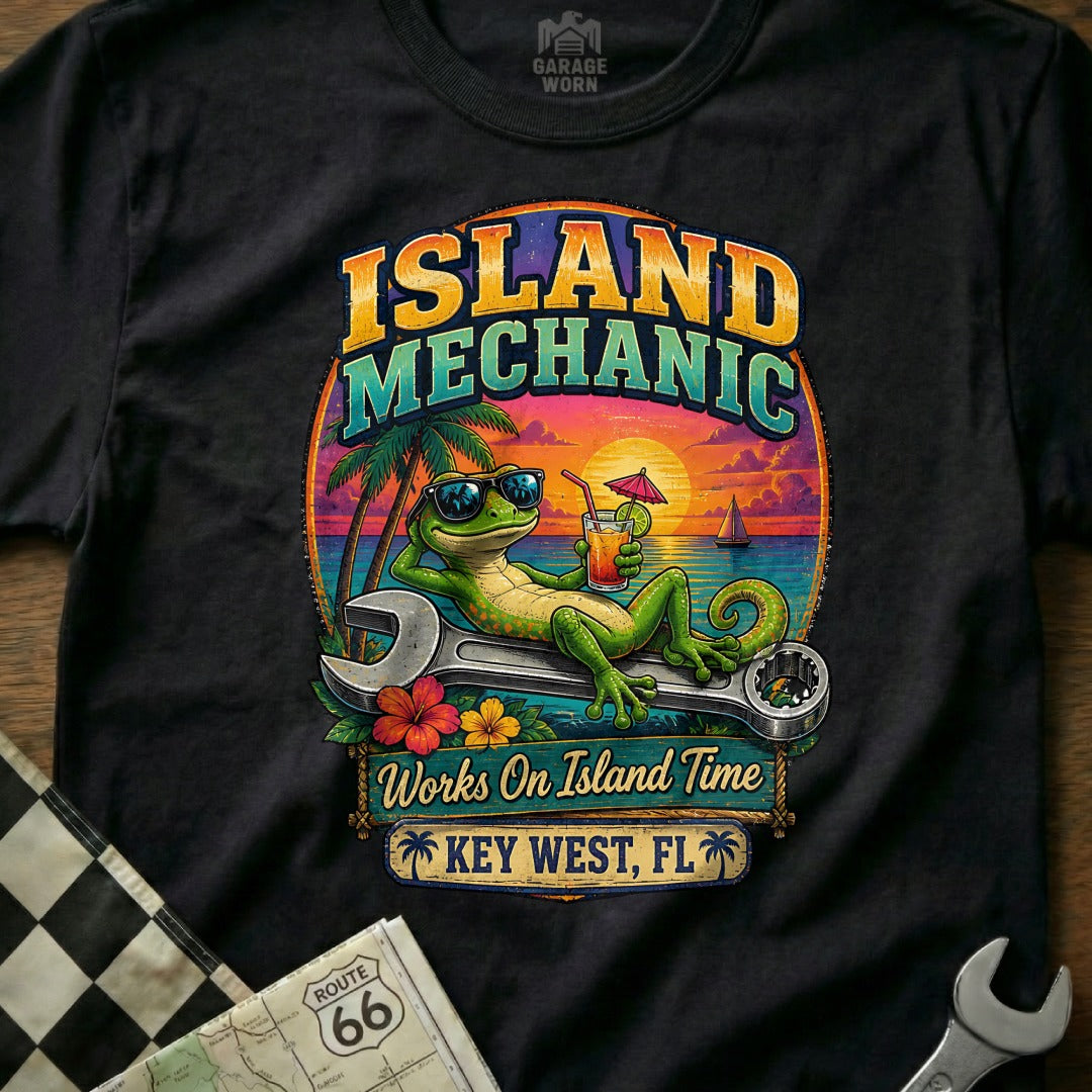 Green gecko on wrench with drink, text "Island Mechanic Works On Island Time Key West, FL".