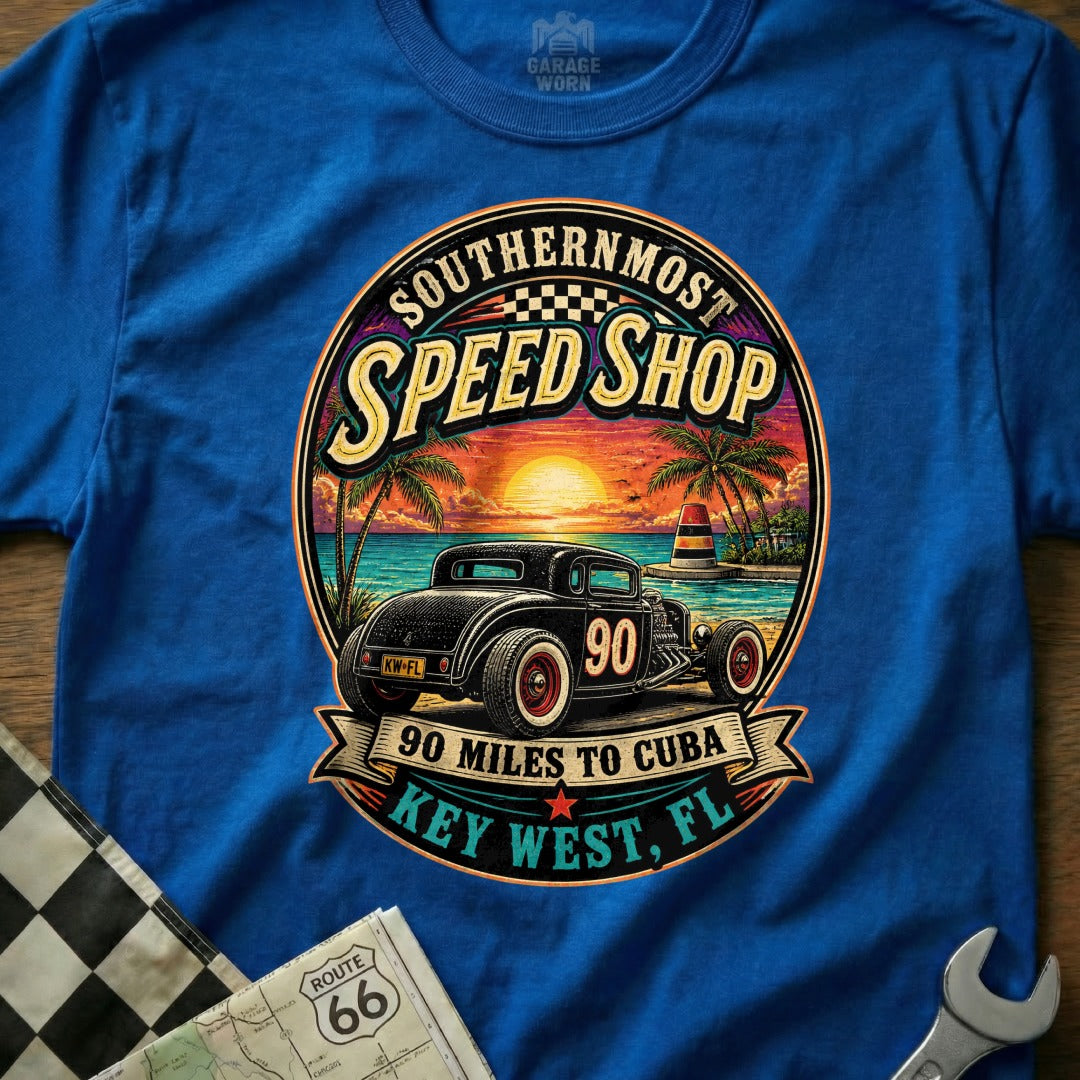 T-shirt graphic of a hot rod at sunset with text "Southernmost Speed Shop" and "Key West, FL".