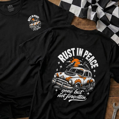 Black t-shirt with "Rust in Peace" graphic on a vintage car.