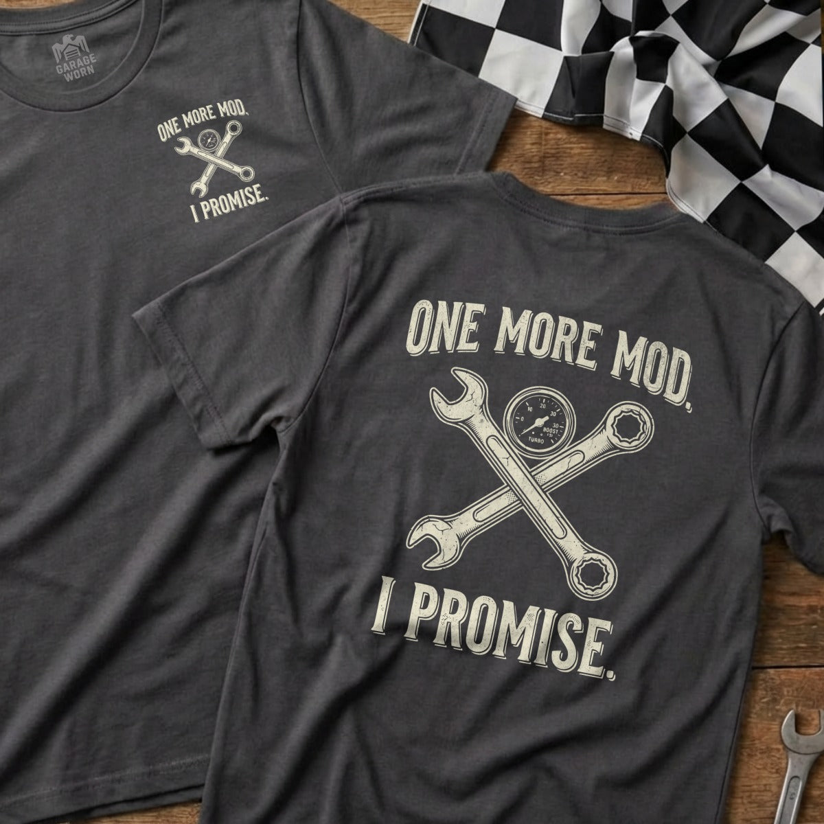 Dark grey t-shirt with crossed wrenches, a gauge, and "ONE MORE MOD I PROMISE."