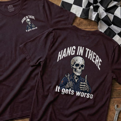 Maroon t-shirt with skeleton giving thumbs up, text "Hang in There, It gets worse".