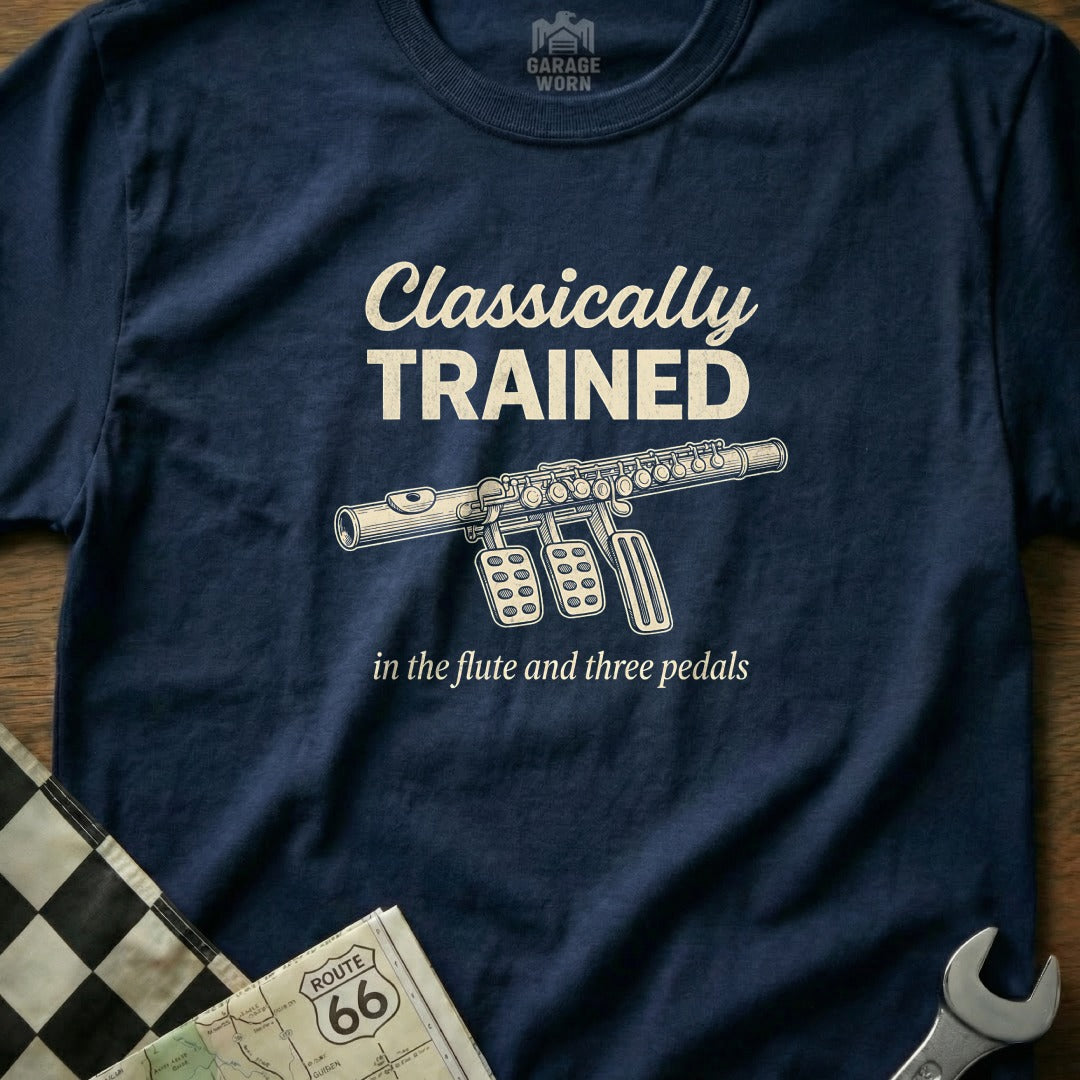 Navy t-shirt with "Classically Trained in the flute and three pedals" and a flute graphic.