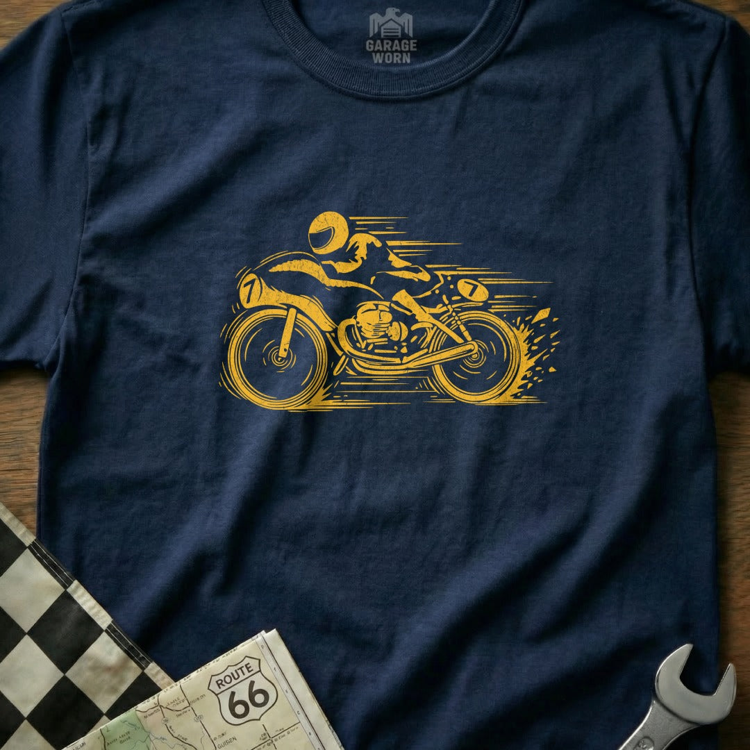 Yellow racing motorcycle with rider on navy blue t-shirt with checkered flag.