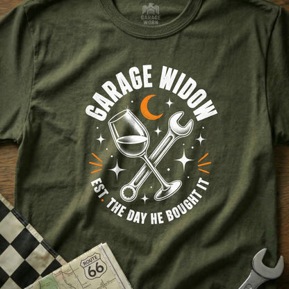 Green t-shirt with "Garage Widow Est. The Day He Bought It" text, wine glass, and wrench.