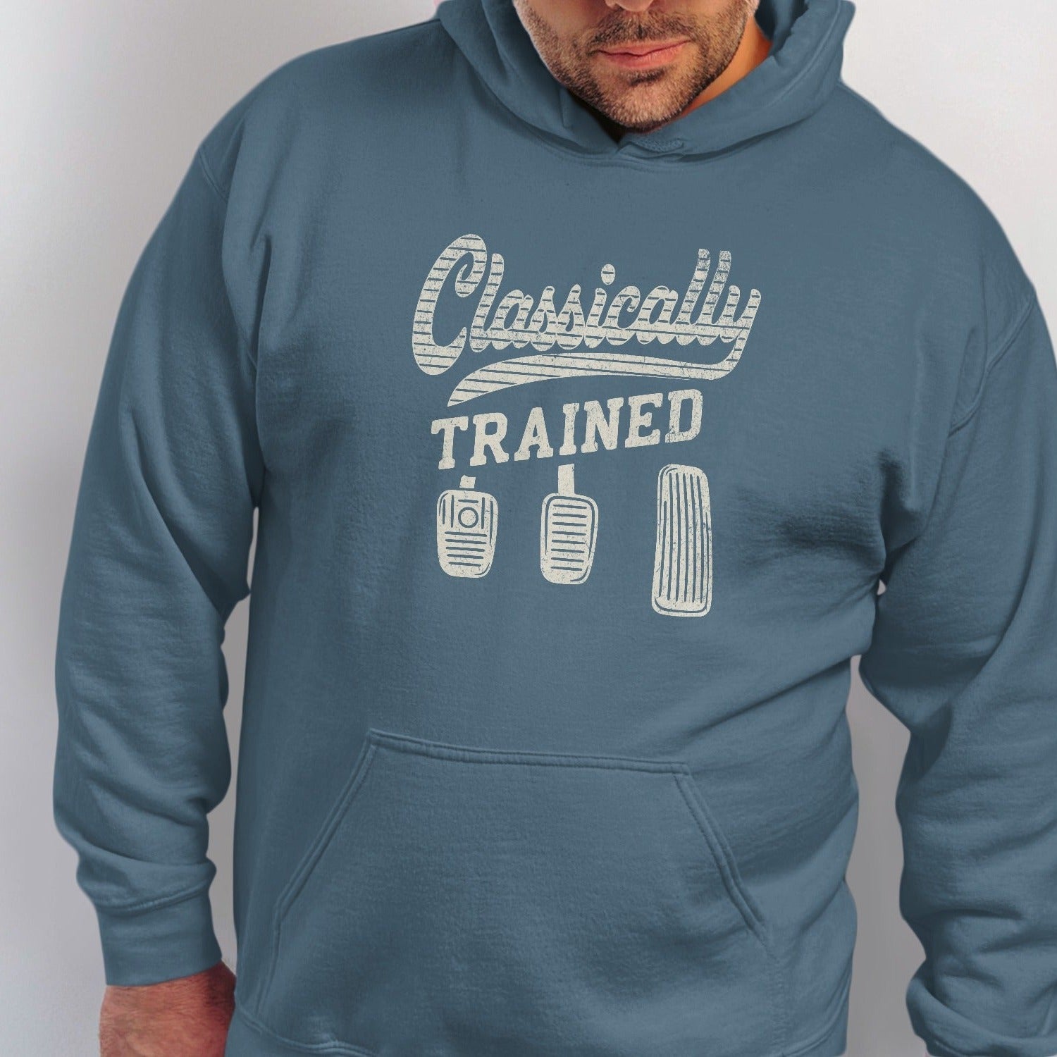 Blue hoodie with "Classically Trained" text and three clutch, brake, and accelerator pedals.