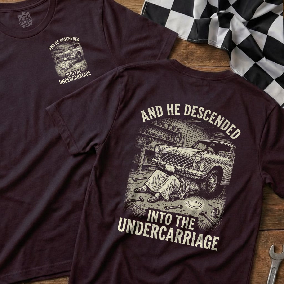 T-shirt with "And He Descended Into The Undercarriage" and illustration.